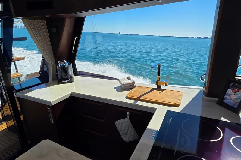 Benellie II Yacht Photos Pics Interior of 2022 Galeon 500 Fly yacht kitchen with ocean view.