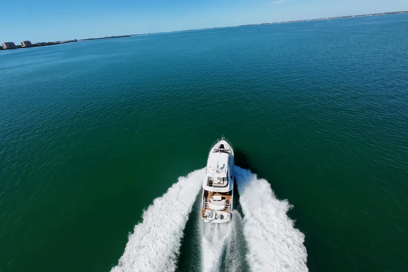 Benellie II Yacht Photos Pics Aerial view of 2022 Galeon 500 Fly yacht cruising on open water.