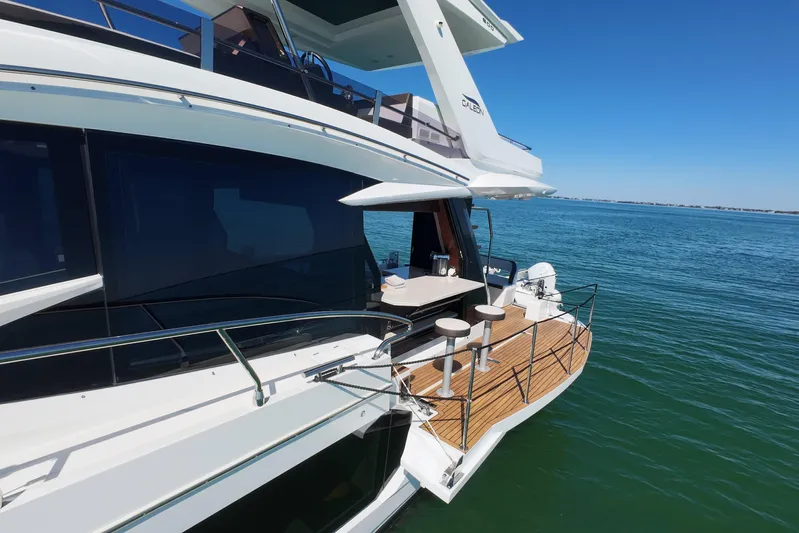 Benellie II Yacht Photos Pics 2022 Galeon 500 Fly yacht with sleek design and spacious deck on calm waters.