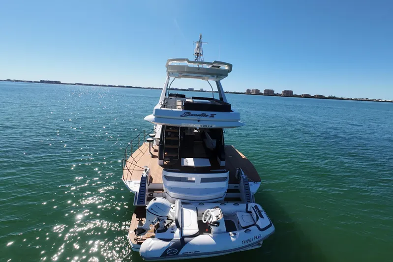Benellie II Yacht Photos Pics 2022 Galeon 500 Fly yacht on calm water, showcasing luxury design and spacious deck.
