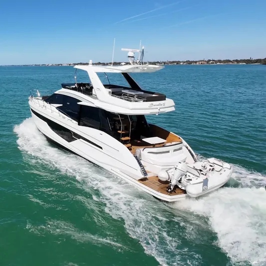 Benellie II Yacht Photos Pics 2022 Galeon 500 Fly yacht cruising on open sea under clear blue sky.
