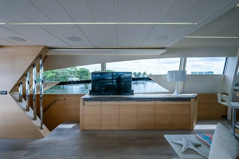 Coal Blooded Yacht Photos Pics Luxurious interior of 2014 Pershing 92 yacht with modern decor and waterfront view.