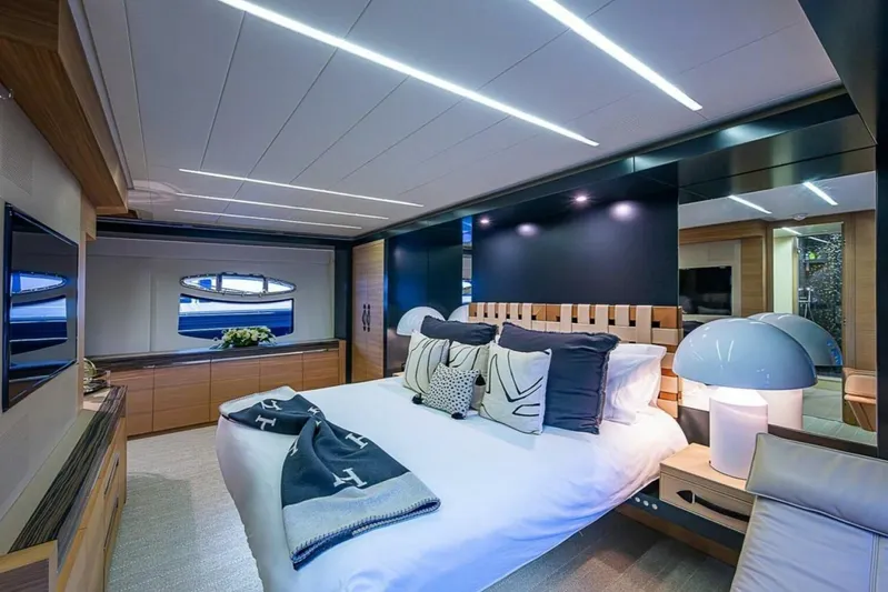 Coal Blooded Yacht Photos Pics Luxurious bedroom interior of 2014 Pershing 92 yacht with modern design and elegant decor.