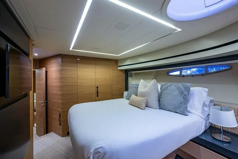 Coal Blooded Yacht Photos Pics Luxurious bedroom interior of 2014 Pershing 92 yacht with modern design and elegant lighting.