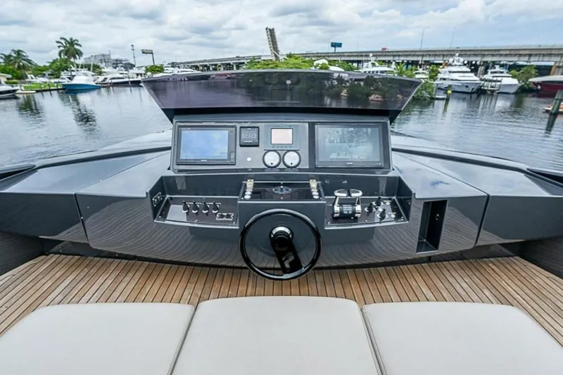 Coal Blooded Yacht Photos Pics 2014 Pershing 92 yacht helm with modern controls and waterfront view.