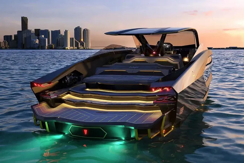  Yacht Photos Pics Luxury Tecnomar Lamborghini 63 yacht on water at sunset, city skyline in background.