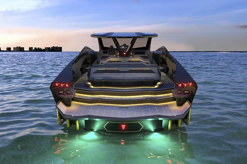  Yacht Photos Pics Futuristic Tecnomar Lamborghini 63 yacht on water, showcasing sleek design and vibrant lights, 2026 model.