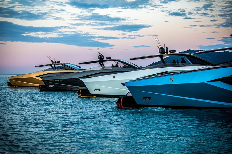  Yacht Photos Pics 2026 Tecnomar Lamborghini 63 yachts in vibrant colors on serene water at sunset.