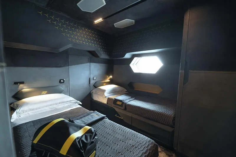  Yacht Photos Pics Luxurious interior of 2026 Tecnomar Lamborghini 63 yacht cabin with modern design and twin beds.