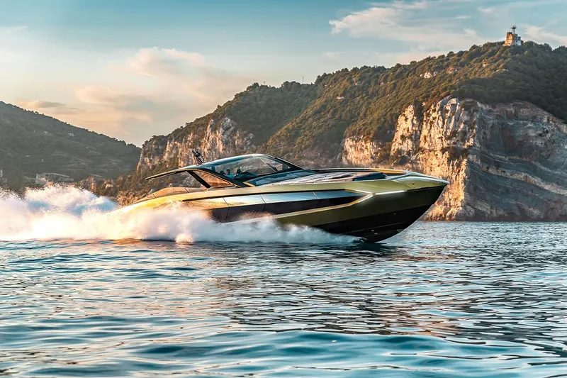  Yacht Photos Pics 2026 Tecnomar Lamborghini 63 yacht cruising on scenic coastal waters.