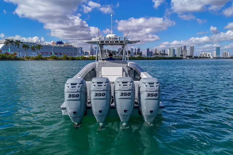  Yacht Photos Pics 2018 SeaVee 390Z boat with four engines on water, city skyline in background.