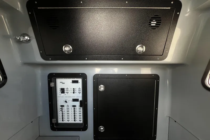  Yacht Photos Pics 2018 SeaVee 390Z control panel with black and silver design in cabin interior.