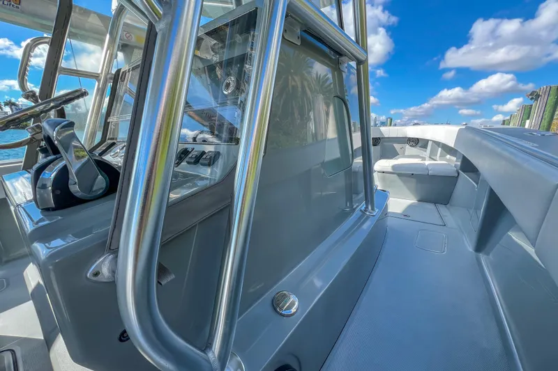  Yacht Photos Pics 2018 SeaVee 390Z boat interior with helm, seating, and clear blue sky.