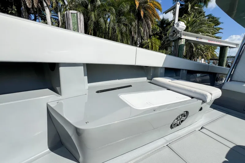  Yacht Photos Pics 2018 SeaVee 390Z boat interior with seating, sleek design, and tropical background.