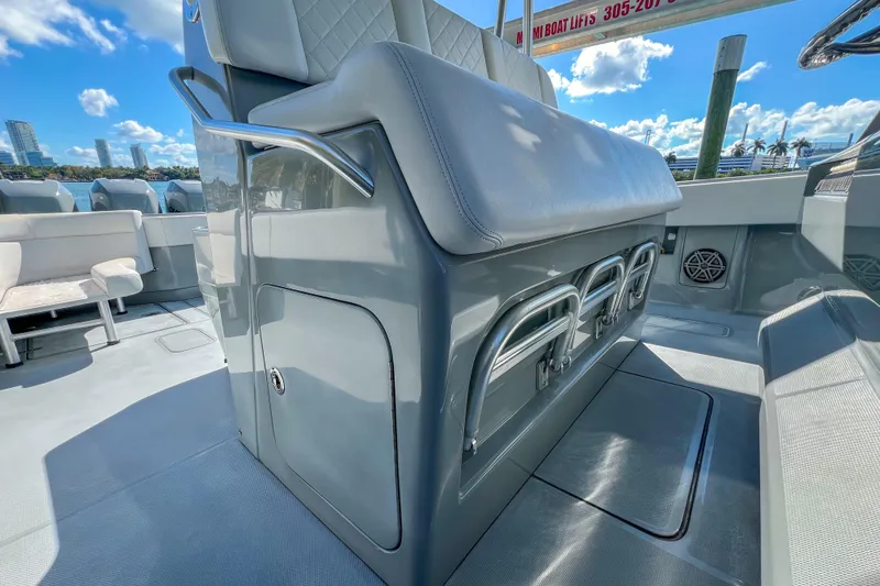 Yacht Photos Pics 2018 SeaVee 390Z boat interior with seating and storage, under a clear blue sky.