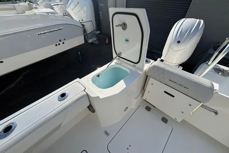  Yacht Photos Pics 2026 World Cat 265 DC-X boat interior with open storage compartment and seating.