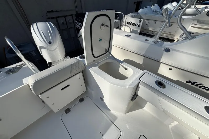  Yacht Photos Pics 2026 World Cat 265 DC-X boat interior with open storage compartment and seating.