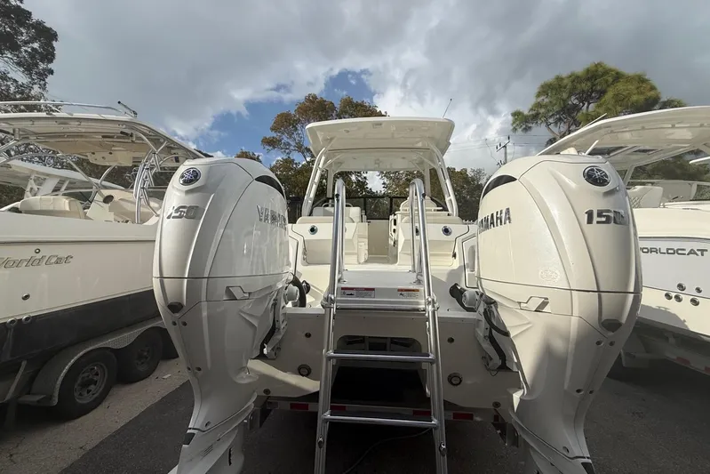  Yacht Photos Pics 2026 World Cat 265 DC-X boat with twin Yamaha 150 engines, docked outdoors.