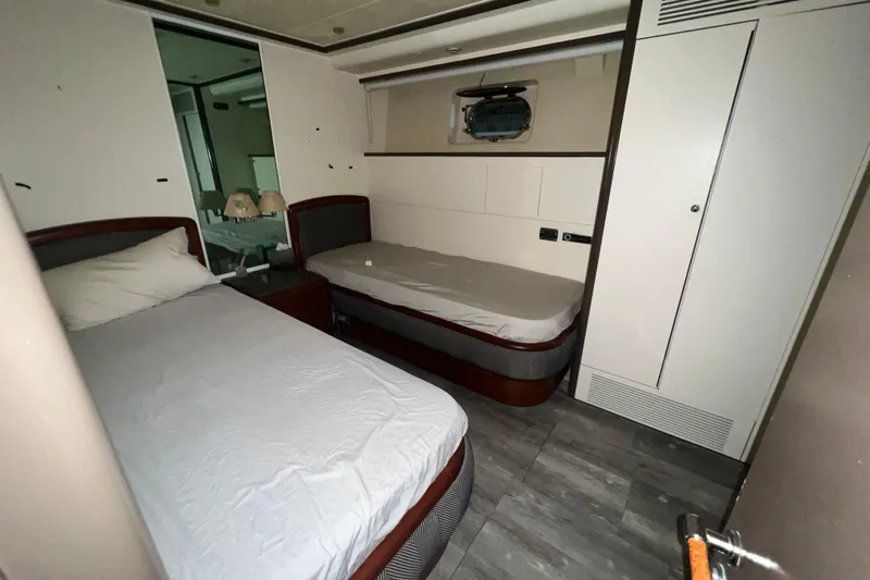M/y Q Yacht Photos Pics Small cabin with twin beds in a 2001 Falcon 106 yacht.