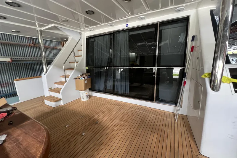 M/y Q Yacht Photos Pics Luxurious Falcon 106 yacht interior with wooden flooring and modern staircase, 2001 model.