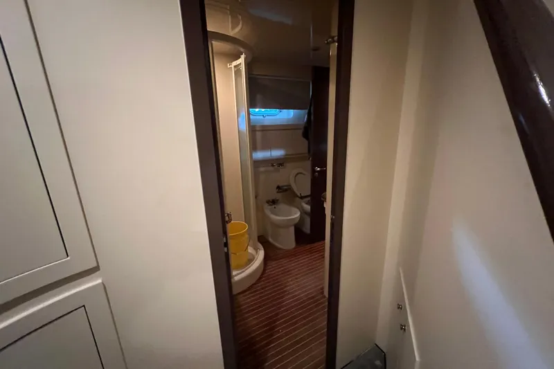 M/y Q Yacht Photos Pics Bathroom interior of 2001 Falcon 106 yacht with shower and toilet.