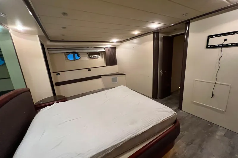 M/y Q Yacht Photos Pics Luxurious bedroom interior of 2001 Falcon 106 yacht with modern design elements.