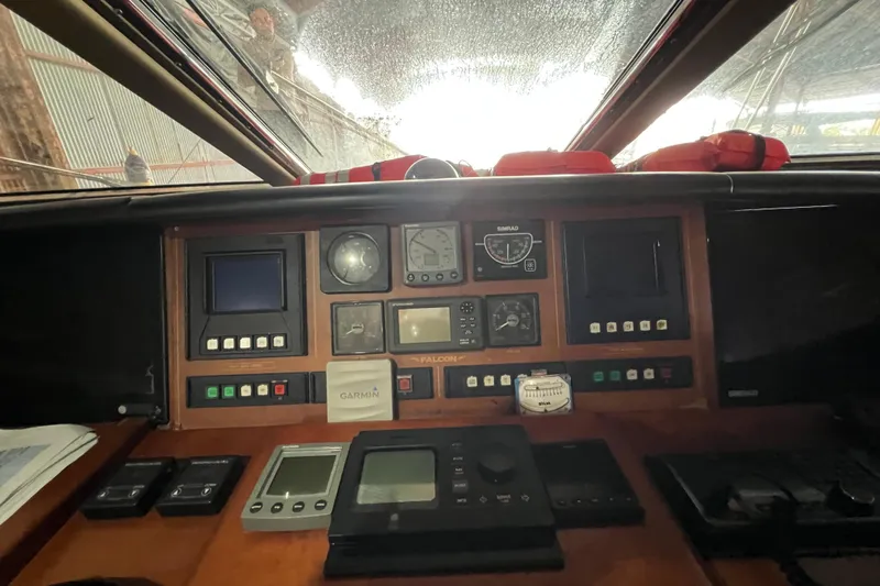 M/y Q Yacht Photos Pics Cockpit of a 2001 Falcon 106 yacht with navigation instruments and controls.