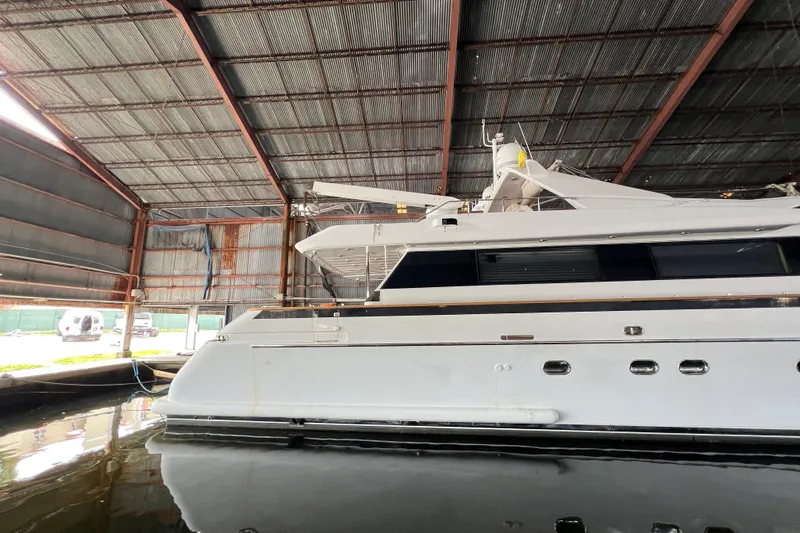 M/y Q Yacht Photos Pics Luxury yacht Falcon 106, 2001 model, docked in a covered marina.