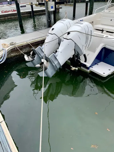  Yacht Photos Pics 2002 Intrepid 348 Walkaround with twin outboard motors docked in marina.
