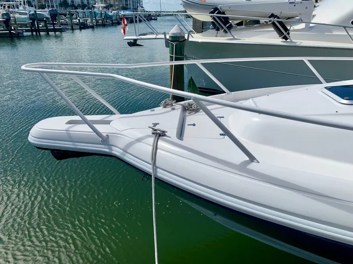  Yacht Photos Pics 2002 Intrepid 348 Walkaround boat docked in marina.