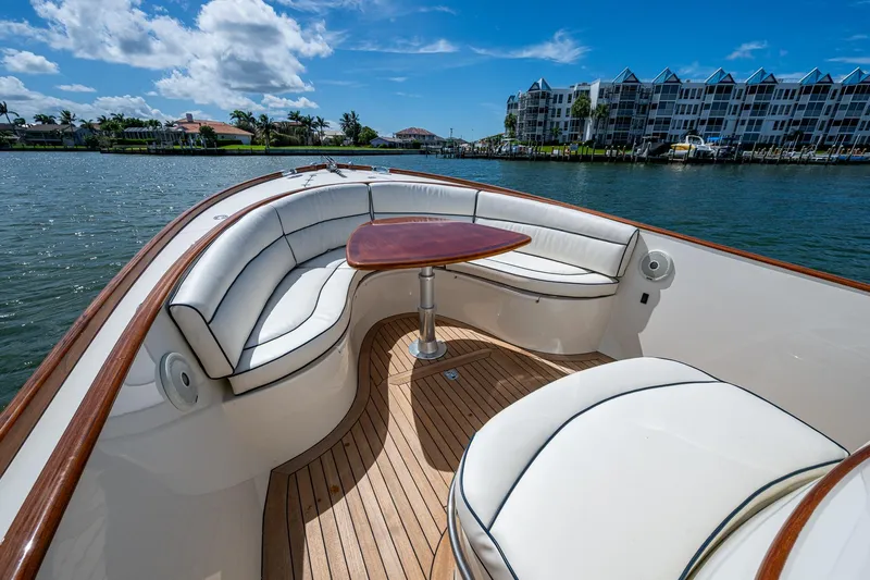 Summer Wind Yacht Photos Pics Luxurious 2003 Hinckley Talaria 29 Center Console boat with elegant seating and wooden deck.