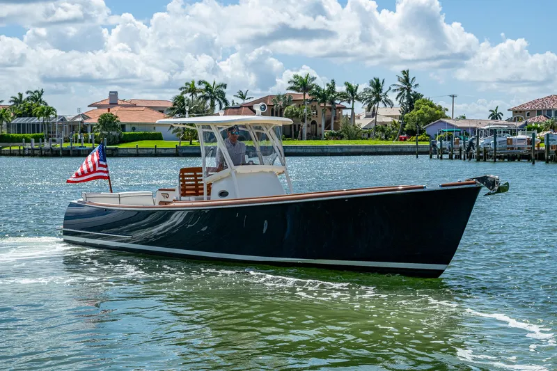 Summer Wind Yacht Photos Pics 2003 Hinckley Talaria 29 Center Console boat cruising on a sunny day.