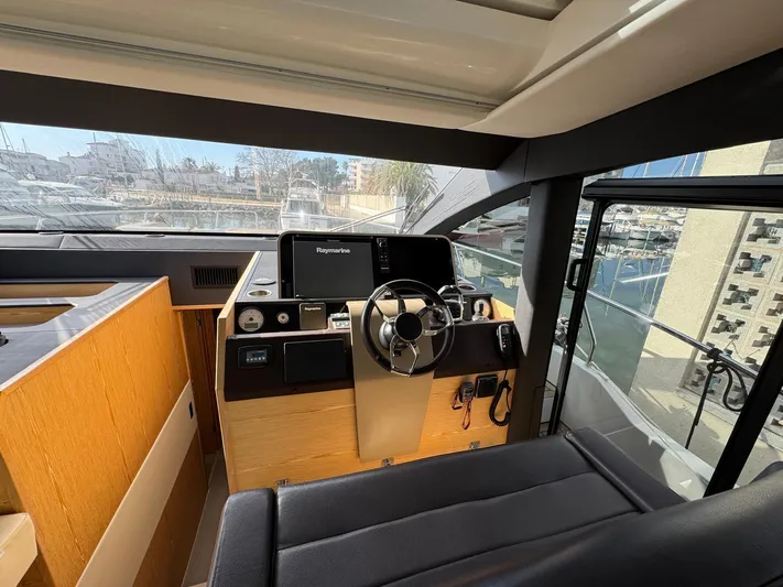 Sealine C530 Yacht Photos Pics Helm of 2017 Sealine C530 yacht with modern controls and panoramic view.