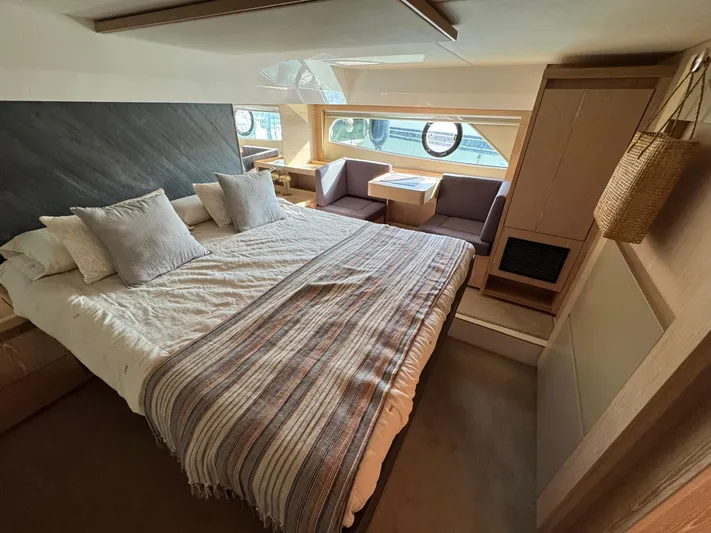 Sealine C530 Yacht Photos Pics Luxurious bedroom interior of 2017 Sealine C530 yacht with modern design and natural light.