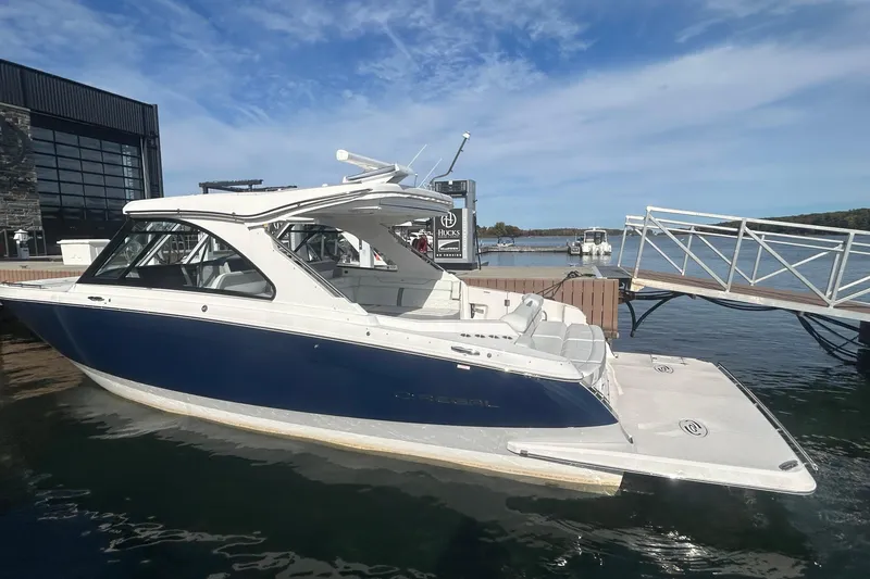  Yacht Photos Pics 2025 Regal LS36 boat docked at marina under clear blue sky.