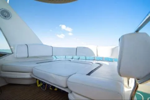 Salty Pause Yacht Photos Pics 2005 Sea Ray 420 Sedan Bridge yacht with spacious white seating and ocean view.