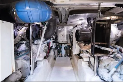 Salty Pause Yacht Photos Pics Engine room of 2005 Sea Ray 420 Sedan Bridge, showcasing mechanical components and systems.