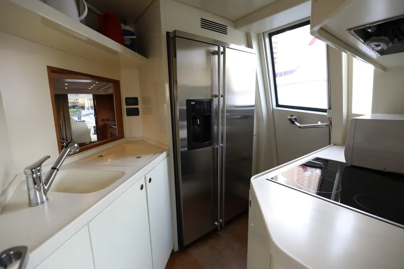  Yacht Photos Pics Modern kitchen interior on 2008 Riva 85 Opera Super yacht, featuring stainless steel appliances.