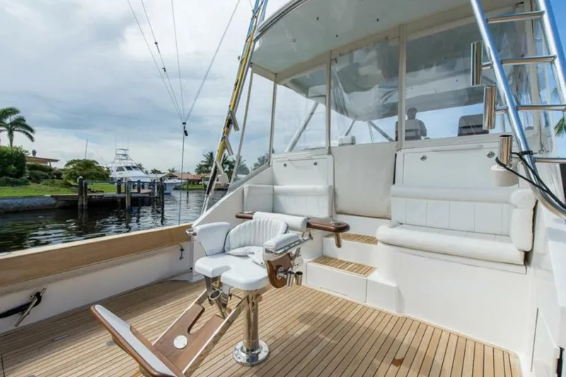  Yacht Photos Pics Luxury 2027 Buddy Davis yacht deck with seating and fishing chair.