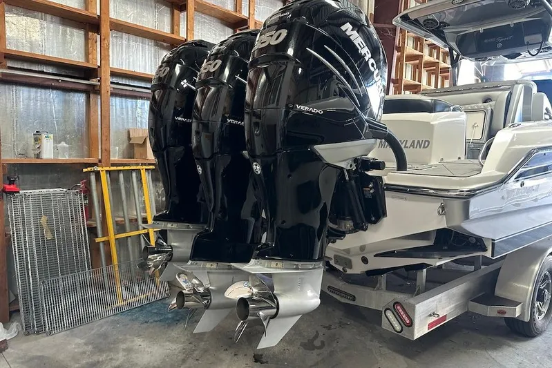  Yacht Photos Pics 2017 Nor-Tech 340 Sport Center Console with triple Mercury Verado engines in a garage.