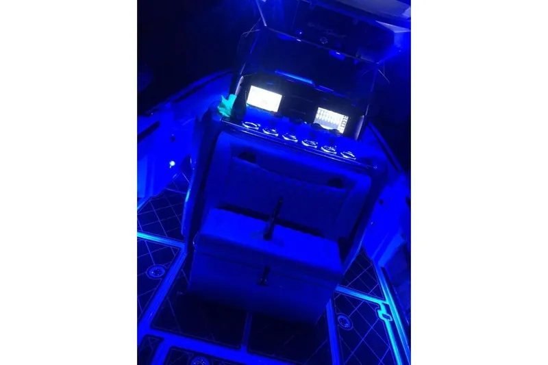  Yacht Photos Pics 2017 Nor-Tech 340 Sport Center Console with illuminated blue cockpit at night.