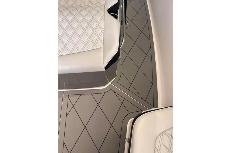  Yacht Photos Pics 2017 Nor-Tech 340 Sport Center Console interior with diamond-stitched seats and patterned flooring.