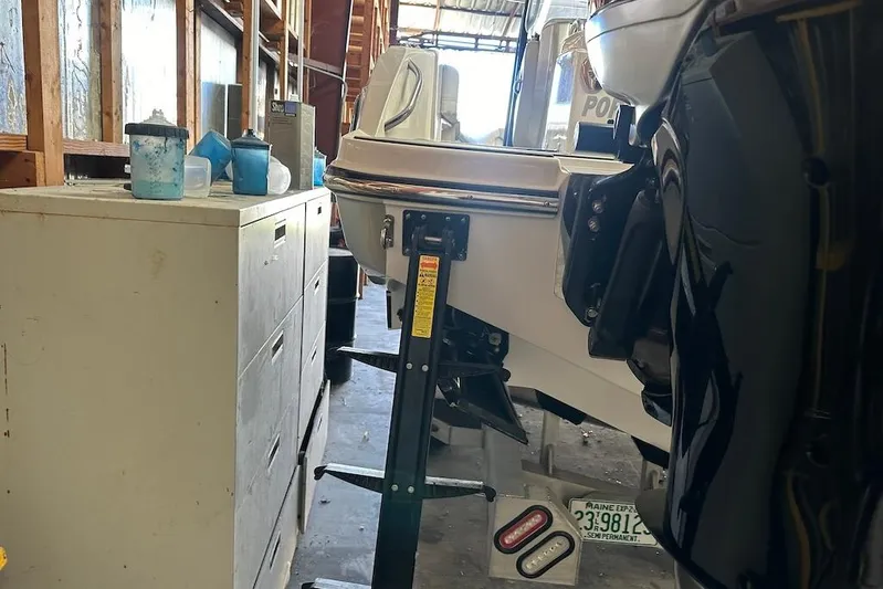  Yacht Photos Pics 2017 Nor-Tech 340 Sport Center Console in storage, alongside filing cabinet and equipment.