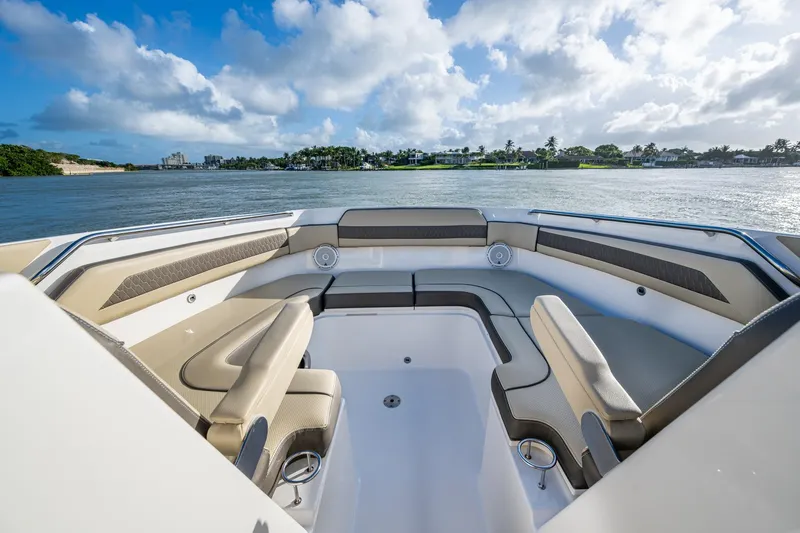  Yacht Photos Pics 2019 Pursuit DC 365 Dual Console boat interior with spacious seating, overlooking serene waters.