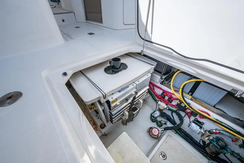  Yacht Photos Pics 2019 Pursuit DC 365 Dual Console boat storage compartment with wiring and equipment.