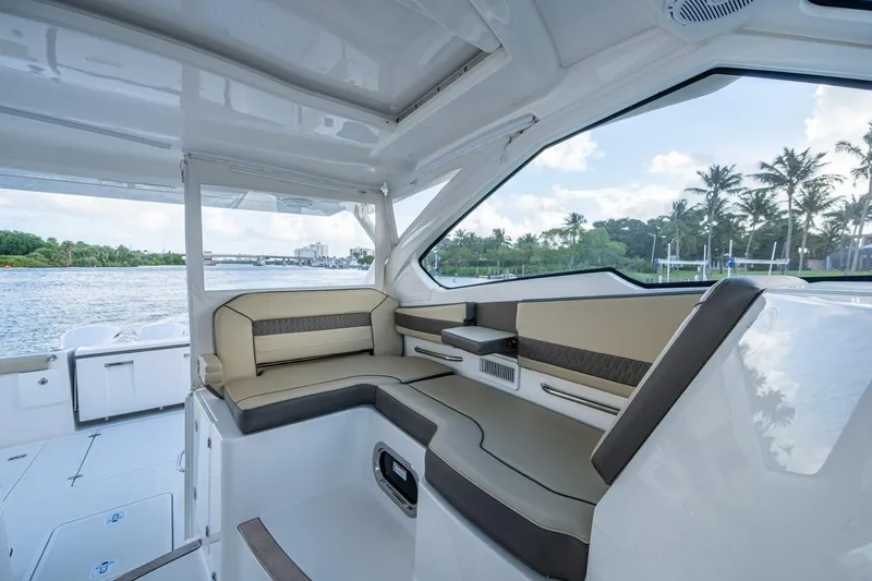  Yacht Photos Pics 2019 Pursuit DC 365 Dual Console interior with luxurious seating and scenic water view.
