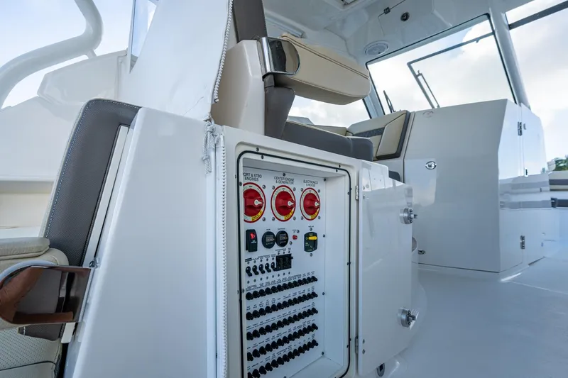  Yacht Photos Pics 2019 Pursuit DC 365 Dual Console boat interior with control panel and seating.
