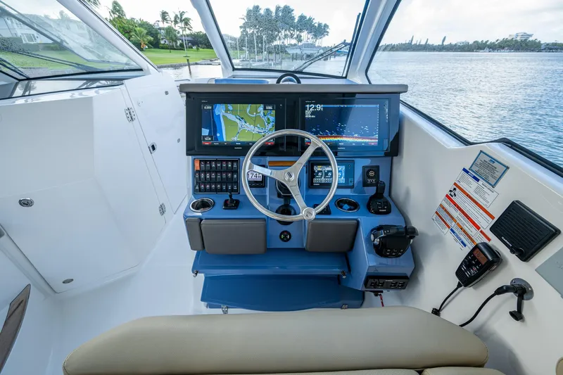  Yacht Photos Pics 2019 Pursuit DC 365 Dual Console boat dashboard with navigation screens and controls.