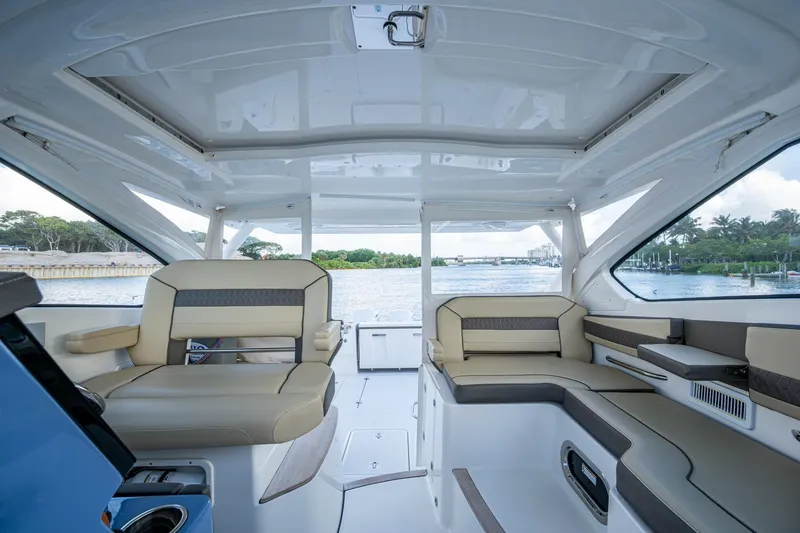  Yacht Photos Pics 2019 Pursuit DC 365 Dual Console interior with spacious seating and scenic water view.