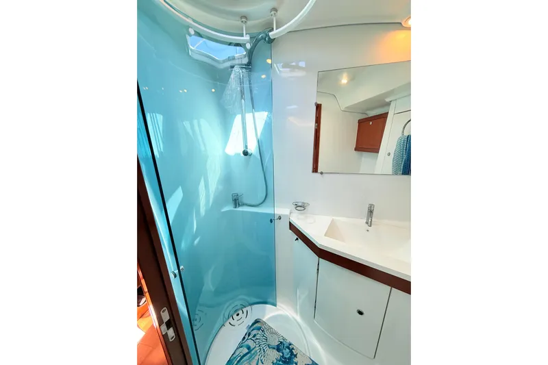 Sunniva Yacht Photos Pics Modern bathroom in 2007 Beneteau Oceanis 46 yacht with shower and sink.